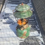 Coleman 200a700 Green Oil Lantern Metal Camping Light Handheld Mpn. Fixed Price $75.00.