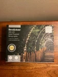Brookstone 200 Led Solar-powered String Lights. Fixed Price $12.00.