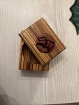 Handcrafted African Zebra Wood Box Floral Inlay Swivel Top. Fixed Price $15.00.