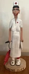 Wood Nurse Hand Carved Figure Bend Over Folk Art Signed Rb 9 W Enema Kit Statue. Fixed Price $59.88.