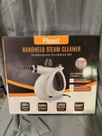 Phueut Multipurpose Handheld Steam Cleaner With Accessory Set- New. Fixed Price $35.00.