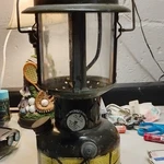 Coleman Liquid Fuel Camping Lantern Green Metal Glass Outdoor Portable Light. Fixed Price $175.00.